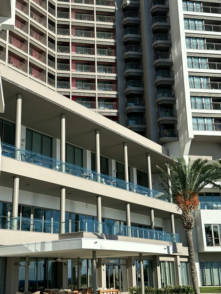 pexels photo 34109644 34109644 Contemporary hotel architecture with palm tree and balconies, captured in daylight.
